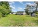 The expansive backyard features lush greenery and mature trees for added privacy at 43 Columbus Ct, Spring Lake, NC 28390
