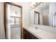 Bathroom with a sink and vanity, a large mirror, and a doorway view into a sunny room at 43 Columbus Ct, Spring Lake, NC 28390