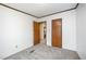 Bedroom featuring neutral walls and carpet, with doorways to other rooms in the home at 43 Columbus Ct, Spring Lake, NC 28390