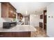 Well-equipped kitchen with granite countertops, stainless steel appliances and tile flooring at 43 Columbus Ct, Spring Lake, NC 28390