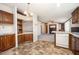 Open-concept kitchen offering views to living space and featuring wood cabinets and tile floors at 43 Columbus Ct, Spring Lake, NC 28390