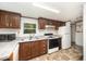 Functional kitchen featuring wooden cabinets, modern appliances, and ample counter space at 43 Columbus Ct, Spring Lake, NC 28390