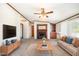Comfortable living room with a fireplace, neutral carpet, and contemporary furnishings at 43 Columbus Ct, Spring Lake, NC 28390