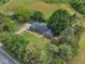 Birds-eye view showing a house surrounded by trees with a yard and road access at 4314 Hopkins Rd, Middlesex, NC 27557