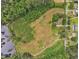 Aerial view showing the property's expansive lot with a lake, bordering a neighborhood with other houses at 4314 Hopkins Rd, Middlesex, NC 27557