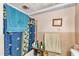 Bathroom including blue accents and a tub with curtain at 4314 Hopkins Rd, Middlesex, NC 27557
