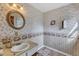 Bathroom featuring patterned wallpaper, a vanity with a mirror, and tiled floors at 4314 Hopkins Rd, Middlesex, NC 27557