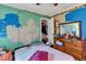 This bedroom features bright walls with colorful features and a view of a closet at 4314 Hopkins Rd, Middlesex, NC 27557