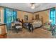 Cozy bedroom with carpet flooring, natural light, and decorative touches at 4314 Hopkins Rd, Middlesex, NC 27557