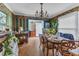 Dining room featuring hardwood floors, wood table and floral wallpaper at 4314 Hopkins Rd, Middlesex, NC 27557