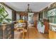 Traditional dining room with wood table, wallpaper and chandelier lighting at 4314 Hopkins Rd, Middlesex, NC 27557