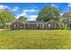 Charming brick home featuring a spacious front yard and manicured landscaping at 4314 Hopkins Rd, Middlesex, NC 27557