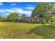 Charming brick home on expansive lawn with mature trees at 4314 Hopkins Rd, Middlesex, NC 27557