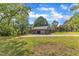 Two-car brick garage featuring two bays and a concrete driveway surrounded by a green lawn at 4314 Hopkins Rd, Middlesex, NC 27557