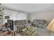 This living room offers neutral walls, ample space, and large windows for lighting at 4314 Hopkins Rd, Middlesex, NC 27557