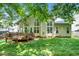 Backyard with a wooden deck, a large wall of windows and doors providing indoor/outdoor flow and great natural light at 437 New Parkside Dr, Chapel Hill, NC 27516