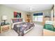 Comfortable bedroom with a floral bedspread, wooden desk and dresser, enhanced by a calming color palette at 437 New Parkside Dr, Chapel Hill, NC 27516