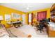 Bright bedroom featuring yellow walls, a ceiling fan, and an array of furniture including a twin bed and a desk at 437 New Parkside Dr, Chapel Hill, NC 27516
