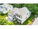 Charming two-story home with black shutters, attached garage and well-manicured landscaping from an aerial view at 437 New Parkside Dr, Chapel Hill, NC 27516