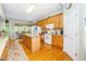 Well-equipped kitchen with wood cabinets, a center island, and modern appliances at 437 New Parkside Dr, Chapel Hill, NC 27516