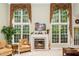 Inviting living room with a fireplace, large windows, and ample natural light at 437 New Parkside Dr, Chapel Hill, NC 27516