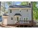 Exterior of the home featuring a small deck, patio, and backyard at 4621 Worthington Ln, Raleigh, NC 27604