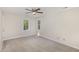This bedroom features neutral walls, carpet, and a ceiling fan at 4621 Worthington Ln, Raleigh, NC 27604