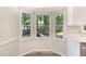 Sunny breakfast nook featuring a bay window with views of the backyard at 4621 Worthington Ln, Raleigh, NC 27604