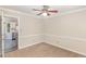 Dining room with neutral paint, carpet, and views into the kitchen at 4621 Worthington Ln, Raleigh, NC 27604