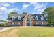 Lovely home exterior featuring manicured lawn and mature landscaping at 4621 Worthington Ln, Raleigh, NC 27604