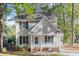Charming two-story home featuring a covered porch and a well-maintained front yard at 4621 Worthington Ln, Raleigh, NC 27604