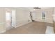 Spacious living room features carpet, a fireplace, and access to the staircase at 4621 Worthington Ln, Raleigh, NC 27604