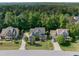 Beautiful aerial view of home surrounded by lush landscaping at 5117 Dove Forest Ln, Apex, NC 27539
