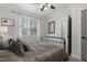 This stylish bedroom features a ceiling fan, neutral tones, and lots of natural light at 5117 Dove Forest Ln, Apex, NC 27539