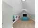 Finished bonus room features plush carpeting and a cozy built-in bookcase at 5117 Dove Forest Ln, Apex, NC 27539