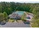 Aerial shot of community center with pool, playground, and parking at 5117 Dove Forest Ln, Apex, NC 27539