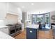 Well-designed kitchen featuring modern appliances, an island, and a bright breakfast nook at 5117 Dove Forest Ln, Apex, NC 27539