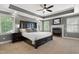 Spacious main bedroom features a tray ceiling, fireplace, and two large windows at 5117 Dove Forest Ln, Apex, NC 27539