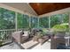 Inviting screened porch with stylish patio furniture at 5117 Dove Forest Ln, Apex, NC 27539