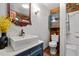 Updated bathroom with modern fixtures, tile shower, and wood paneling at 515 Tramway West Rd, Sanford, NC 27330