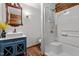 Bathroom features a tiled shower, modern sink, and updated fixtures at 515 Tramway West Rd, Sanford, NC 27330