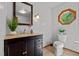 Bathroom features a modern vanity and a uniquely shaped octagon window at 515 Tramway West Rd, Sanford, NC 27330
