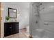 Bathroom features a shower and tub combo, modern vanity, and tiled floors at 515 Tramway West Rd, Sanford, NC 27330