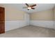 Empty bedroom with carpeted floors, white wainscotting and a large window at 515 Tramway West Rd, Sanford, NC 27330