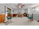 Bright bonus room features wood-paneled walls, carpeted floors, and a ceiling fan at 515 Tramway West Rd, Sanford, NC 27330