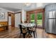 Cozy dining area with backyard access, table with seating, and modern lighting at 515 Tramway West Rd, Sanford, NC 27330