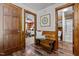 Hallway with access to a bedroom and bathroom with a decorative bench at 515 Tramway West Rd, Sanford, NC 27330