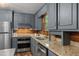 Updated kitchen with stainless steel appliances, granite countertops, and natural light at 515 Tramway West Rd, Sanford, NC 27330
