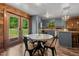 Charming eat-in kitchen features updated cabinets, wood floors, and views of backyard at 515 Tramway West Rd, Sanford, NC 27330