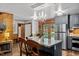 Bright kitchen with stainless steel appliances, eat in dining, and modern lighting at 515 Tramway West Rd, Sanford, NC 27330
